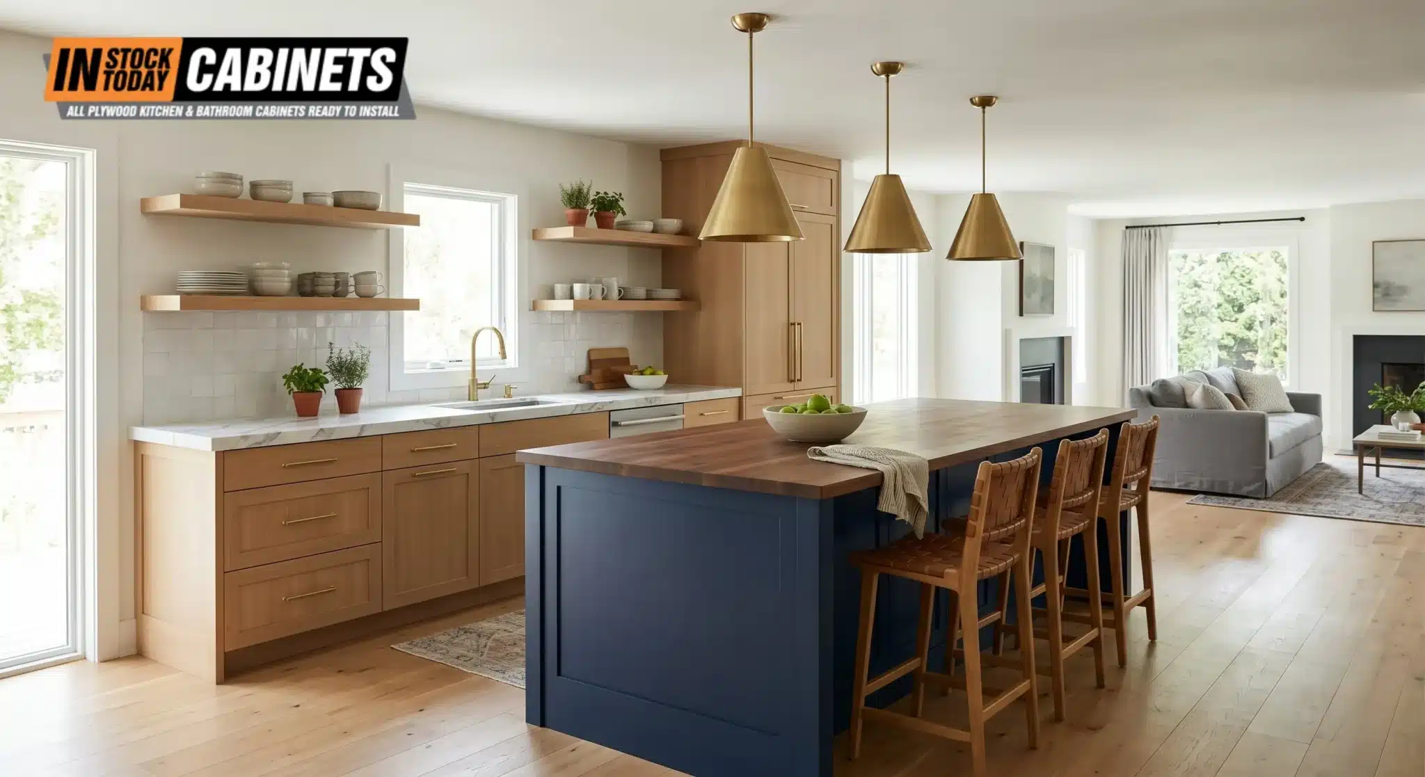 Two-tone open-plan kitchen with light oak perimeter cabinets and a deep navy contrasting island